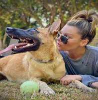 She is a proud mother of a dog named Pepper and loves to explore the world with him She is a proud mother of a dog named Pepper and loves to explore the world with him.